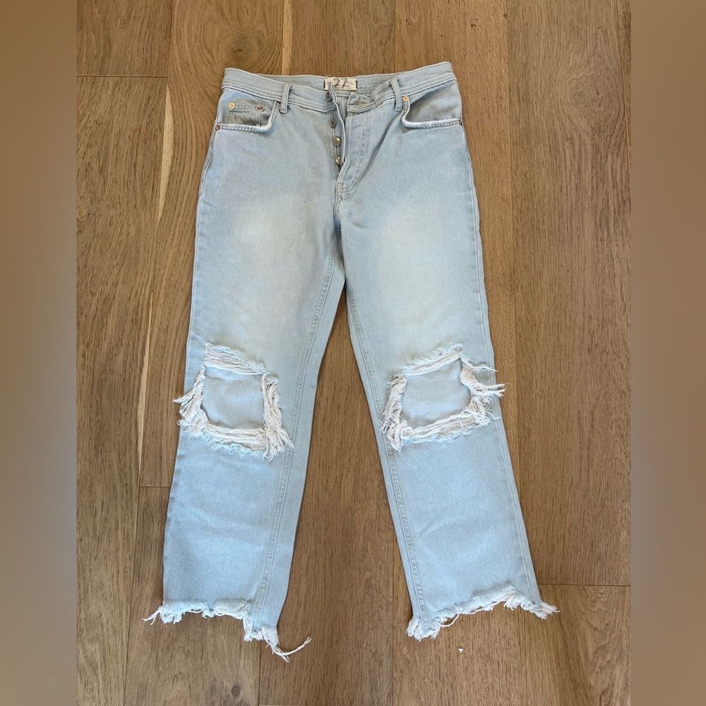 We The Free light washed button fly jeans